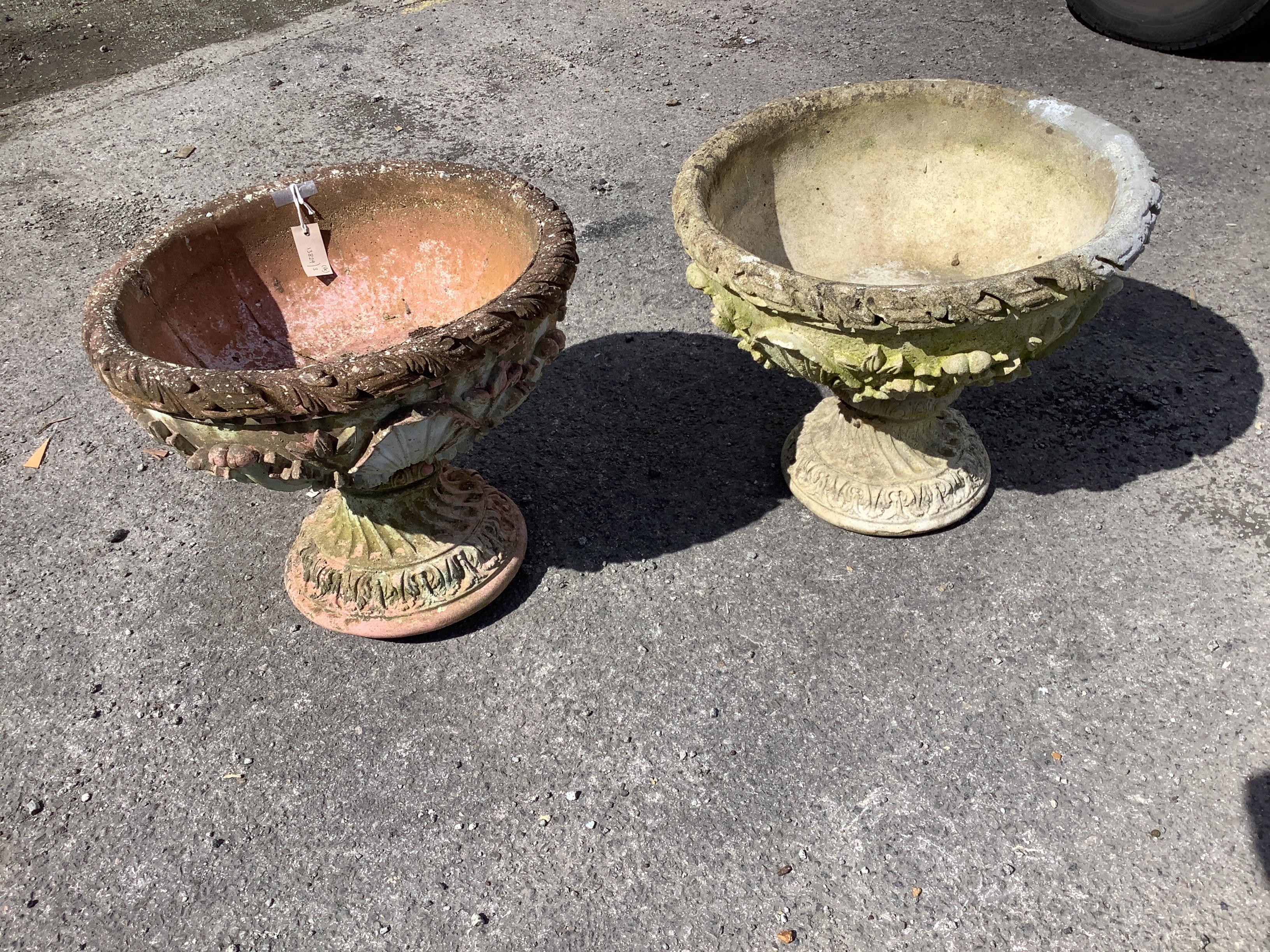 A pair of circular reconstituted stone campana garden planters, diameter 53cm, height 45cm